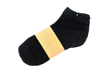 top view of dark gray color men's socks in the package with blank label for sale isolated on white background