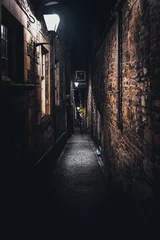 Printed kitchen splashbacks Narrow Alley A dark creepy narrow European alley at night, surrounded by bricks and cobblestone. Illuminated only with some street lamps. Concept of scared or being alone and frightened