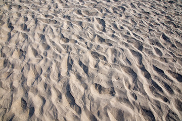 drawings and footprints in the sand