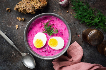 Cold summer vegetable soup with beet and egg in bowl, top view. Russian, polish cuisine. Svekolnik...