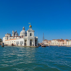 Fototapeta na wymiar Grand Canal in Venice, Italy. Scenic panoramic view on Venetian landmarks - water surface and seafront with buildings and architecture attractions. 