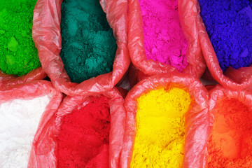 Colorful piles of powdered dyes used for Holi festival in India