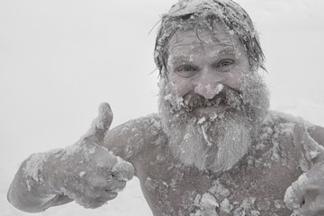 Bearded man, after bathing in the snow - 288607563