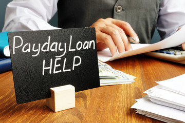Plate with sign Payday loan help and working manager.