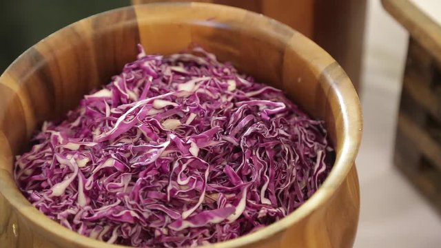 slice of  red cabbage in wooden bowl. Vegetarian healthy food. Top view