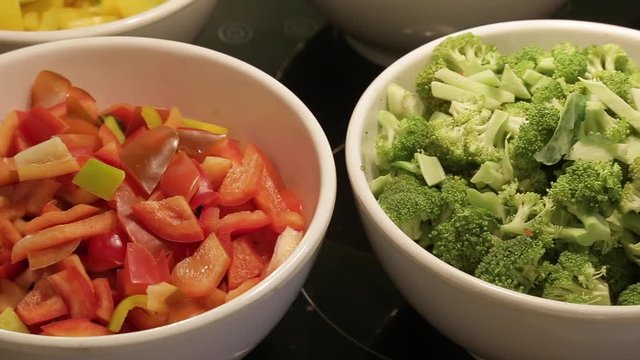 Healthy vigetable  chopped broccoli tomato in the white bowl  