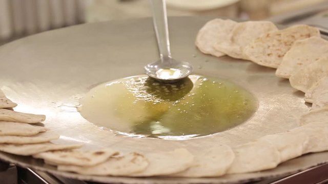 Indian Chapati Fulka or Gehu Roti on steel pan It's a Healthy fiber rich traditional North/South Indian food, 