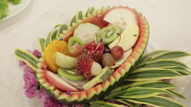 fruit salad with red flower decoration 