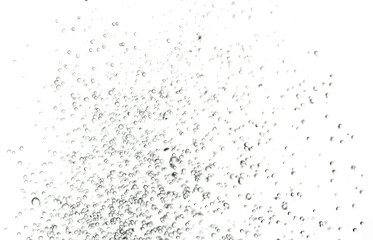 splashes, jets and drops of water hovering in the air on a white background