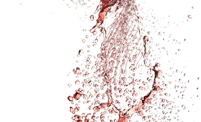 flying splashes, jets and drops of red wine hovering in the air on a white background
