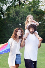 Fototapeta premium Happy young family in the park