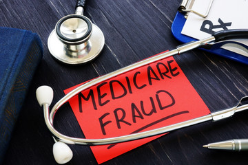 Medicare fraud sign and stethoscope with papers. - obrazy, fototapety, plakaty