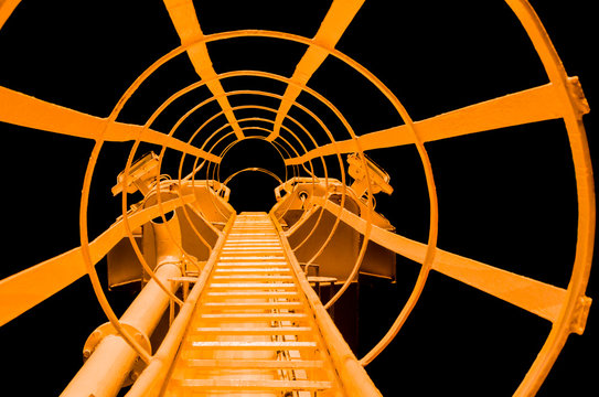 Ladder on a lightning rod against the night sky