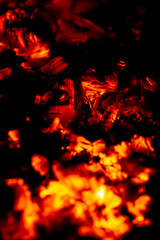 Fototapeta na wymiar burning firewood on black background