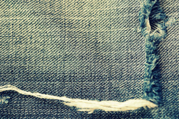 Old torn jeans close-up. Denim background