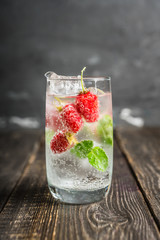 Raspberry mojito cocktail on the rustic background. Selective focus. Shallow depth of field.