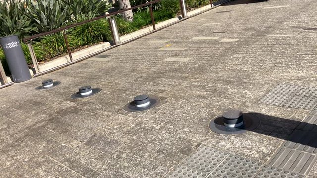 Anti-Terrorist Bollards being raised during protests, Brisbane, Queensland