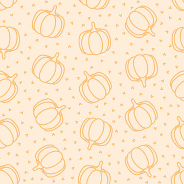 Seamless pattern with pumpkins and hearts