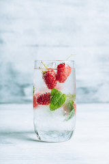 Raspberry mojito cocktail on the rustic background. Selective focus. Shallow depth of field.