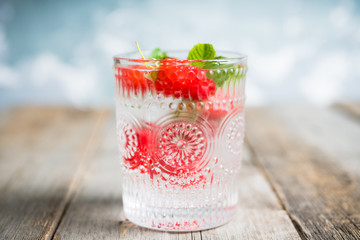 Old fashioned raspberry cocktail. Selective focus. Shallow depth of field.