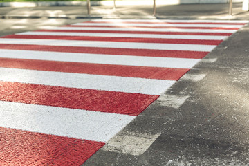pedestrian crossing over the street in the city. red and white color