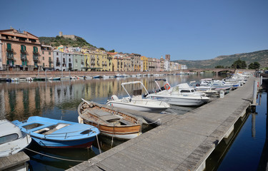 Fototapeta na wymiar boats in the Temo River harbor of Bosa town, in Sardinia