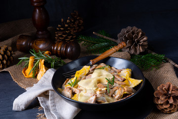 Colorful farfalle pasta with chanterelles and cream sauce.