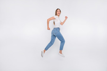 Fototapeta na wymiar Full length body size photo of attractive nice cute girl running away from camera while isolated with white background
