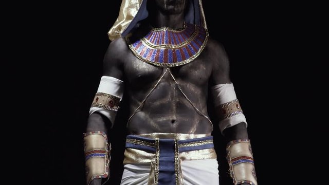 Ancient egyptian clothes on Anubis in a dark room