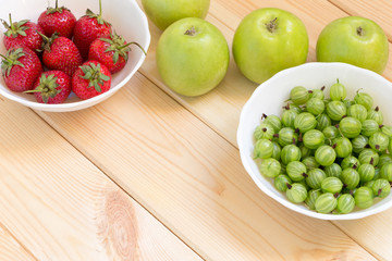 New harvest of fruits and berries. Background with copy space.