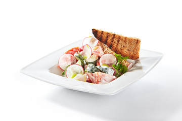 Rustic Salad of Radish, Cucumber, Tomatoes with Sour Cream and Rye Croutons Isolated