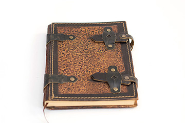 Brown leather notebook on a white background