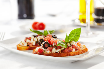 Italian Appetizer Bruschetta with Tomatoes, Cheese and Basil