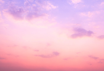 Fototapeta premium Beautiful pink and purple sunset sky with soft fluffy clouds background