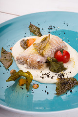Cooked white fish fillet served with mashed potatoes