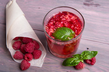 Glass of fresh strawberry summer cocktail and strawberries on the wooden background. Healthy food and drink concept.