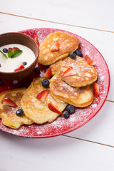 Pancakes with berries and cream