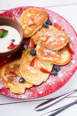 Pancakes with berries and cream