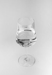 Glass with water on white background