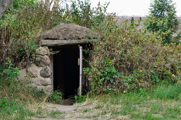 A dugout (or dug-out, pit-house, earth lodge, cellar dug). Traditional shelter for humans and...