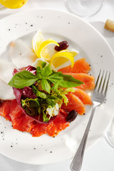 Gourmet, restaurant, delicious dinner food - close up of Fish Dish with Lemon and Fresh Basil Leaves