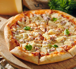 Pizza Restaurant Menu - Delicious Fresh Pizza with Chicken and Pineapple. Pizza on Rustic Wooden Table with Ingredients