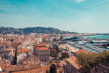 Fototapeta premium Panorama of Cannes, Cote d'Azur, France, South Europe. Nice city and luxury resort of French riviera. Famous tourist destination with nice beach and Promenade de la Croisette on Mediterranean sea