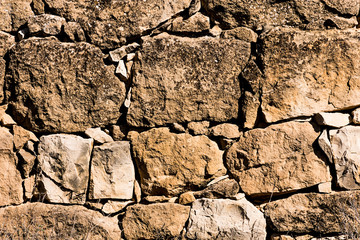 Ancient stone wall in a rural zone. Old stones texture. Dry stone "pedras Seca" . Outdoors txtured.