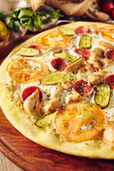 Homemade pizza on wooden table top view