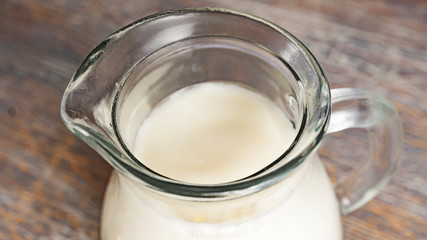 Close-up of a jug of milk, top view, macro image