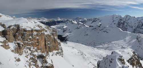Picturesque panoramic view of Pordoi Pass and Marmolada group in winter. Dolomite Alps. Italy.