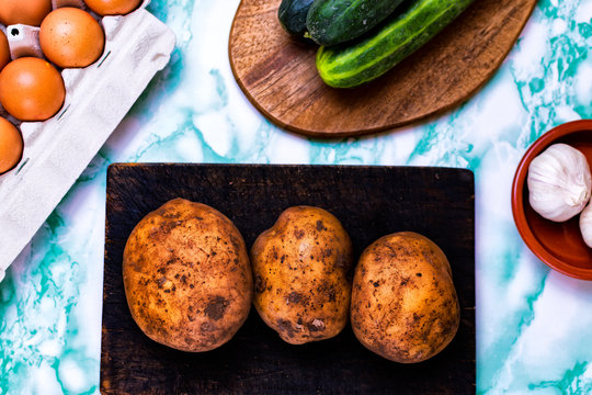 Ovo vegetarianism concept. Food from farms like potatoes, cucumbers and eggs.