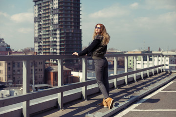 Outdoor lifestyle portrait of pretty young girl, wearing in hipster swag grunge style urban background.