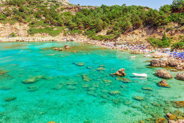 Naklejka na ściany i meble Sea skyview landscape photo Anthony Quinn bay near Ladiko bay on Rhodes island, Dodecanese, Greece. Panorama with nice sand beach and clear blue water. Famous tourist destination in South Europe